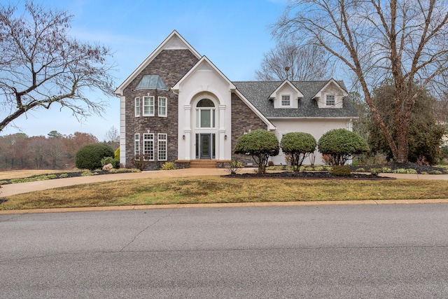 front of property featuring a front lawn