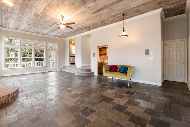 unfurnished living room with a towering ceiling, ceiling fan, crown molding, and wood ceiling