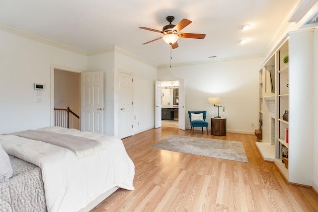 bedroom with ceiling fan, light hardwood / wood-style floors, ornamental molding, and connected bathroom