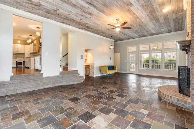 unfurnished living room with ceiling fan, wooden ceiling, and ornamental molding