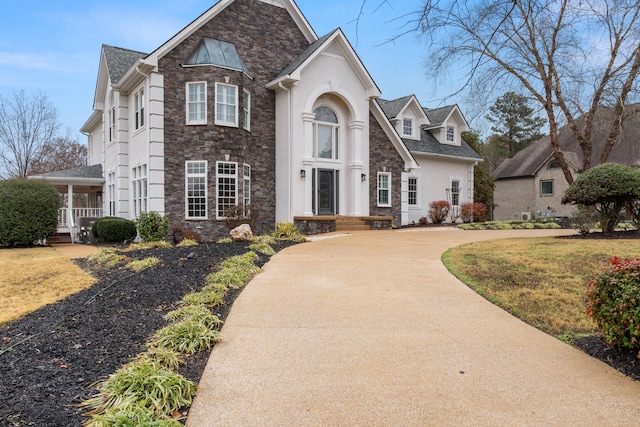 view of property featuring a front lawn