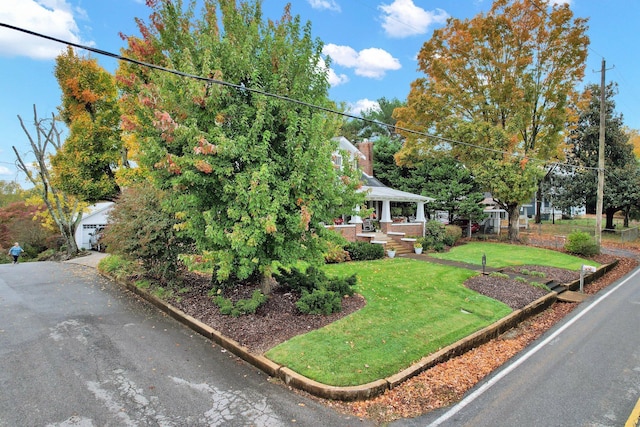 431 Highland Ave NW, Cleveland, TN 37311 - view of front of home with a front yard, a porch, and a chimney