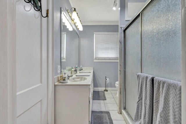 431 Highland Ave NW, Cleveland, TN 37311 - bathroom featuring double vanity, tile patterned flooring, ornamental molding, and an enclosed shower
