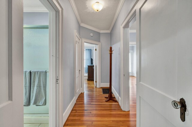 431 Highland Ave NW, Cleveland, TN 37311 - hallway featuring wood finished floors, a textured ceiling, and crown molding