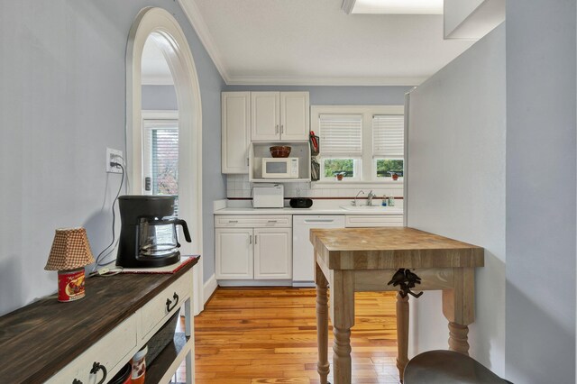 431 Highland Ave NW, Cleveland, TN 37311 - kitchen featuring white appliances, ornamental molding, wooden counters, light wood-style flooring, and white cabinetry