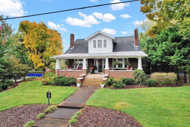 431 Highland Ave NW, Cleveland, TN 37311 - view of front of property featuring a chimney, a porch, and brick siding