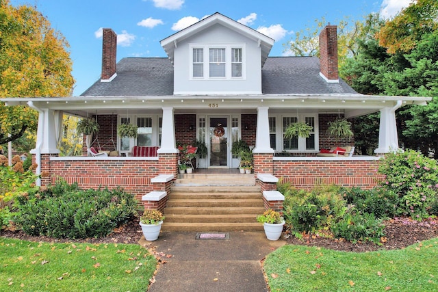 431 Highland Ave NW, Cleveland, TN 37311 - view of front facade featuring a chimney, a porch, and brick siding