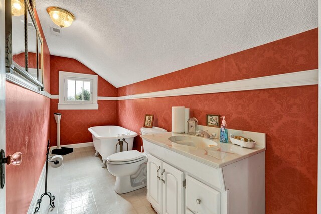 431 Highland Ave NW, Cleveland, TN 37311 - bathroom featuring vaulted ceiling, a textured ceiling, a freestanding tub, vanity, and wallpapered walls