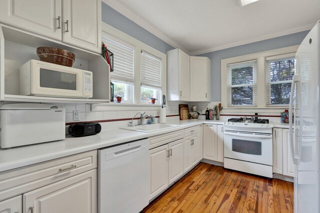 431 Highland Ave NW, Cleveland, TN 37311 - kitchen with white appliances, white cabinets, crown molding, and light countertops
