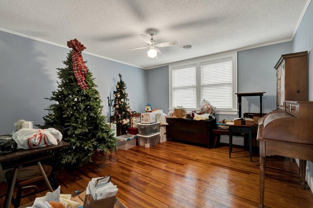 431 Highland Ave NW, Cleveland, TN 37311 - living area featuring ceiling fan, wood-type flooring, a textured ceiling, and ornamental molding