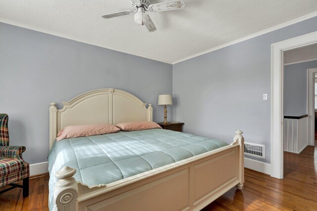 431 Highland Ave NW, Cleveland, TN 37311 - bedroom with wood finished floors, a textured ceiling, ornamental molding, and ceiling fan