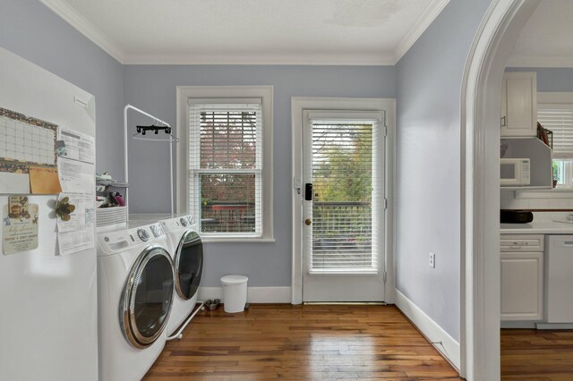 431 Highland Ave NW, Cleveland, TN 37311 - washroom featuring washer and clothes dryer, hardwood / wood-style floors, ornamental molding, and arched walkways