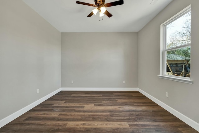 empty room featuring dark hardwood / wood-style floors and ceiling fan