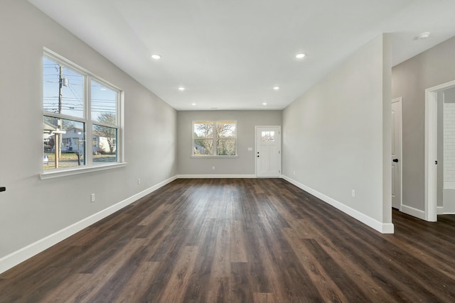 spare room featuring dark wood-type flooring