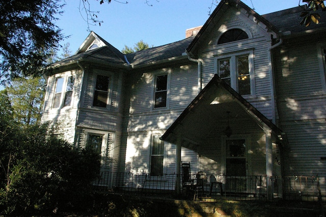 view of front of house featuring a chimney