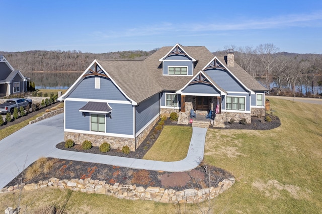 craftsman inspired home featuring a porch and a front yard