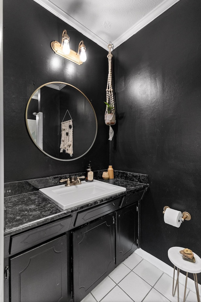 bathroom with ornamental molding, tile patterned flooring, and vanity