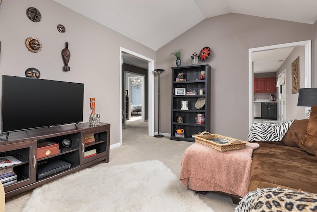 carpeted living room with lofted ceiling