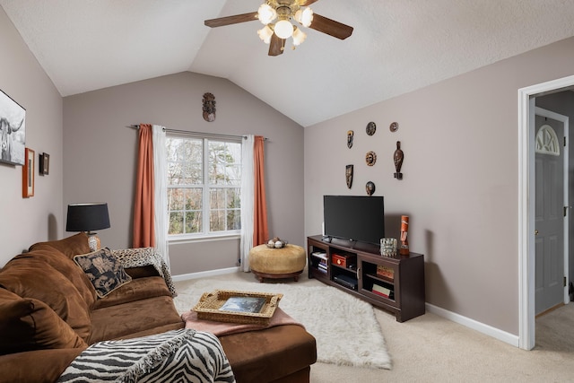 living room featuring a textured ceiling, vaulted ceiling, light colored carpet, and ceiling fan