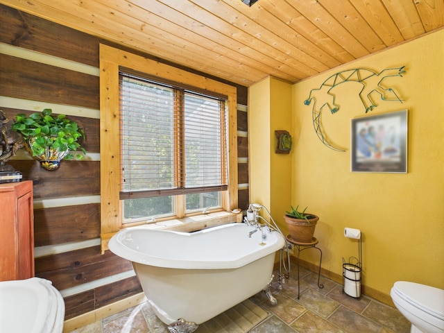 1150 Pin Hook Rd, Spring City, TN 37381 - bathroom featuring wood ceiling, a soaking tub, and stone finish flooring