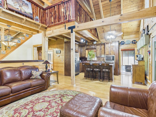1150 Pin Hook Rd, Spring City, TN 37381 - living area featuring wooden walls, light wood-style floors, a towering ceiling, and a wooden ceiling with exposed beams