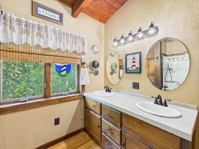 1150 Pin Hook Rd, Spring City, TN 37381 - bathroom with a wooden ceiling with exposed beams, a textured wall, wood finished floors, and double vanity