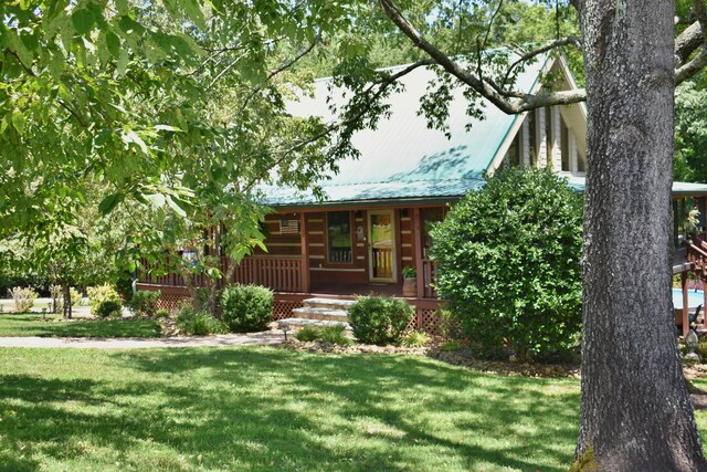 1150 Pin Hook Rd, Spring City, TN 37381 - view of front facade featuring covered porch, a front yard, and a metal roof