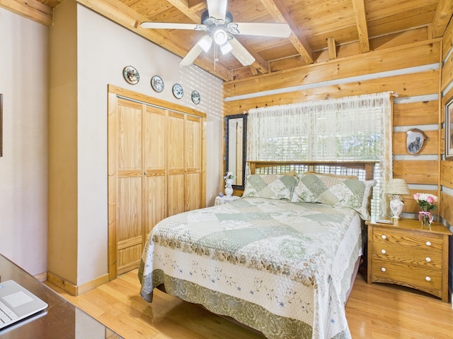 1150 Pin Hook Rd, Spring City, TN 37381 - bedroom with wood finished floors, a wood ceiling with exposed beams, a closet, wood walls, and a ceiling fan