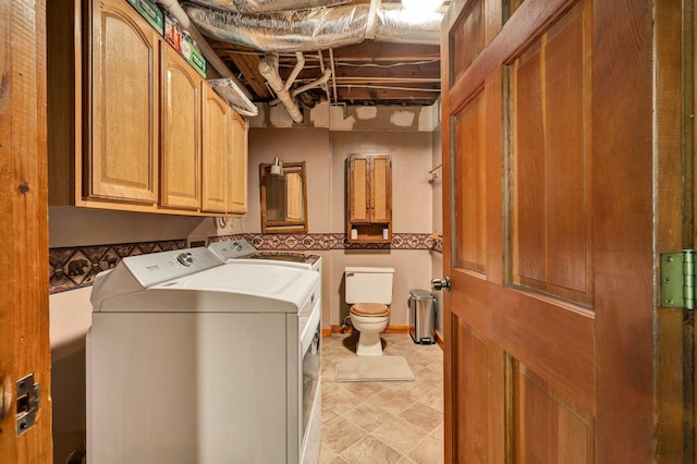 clothes washing area featuring laundry area and washing machine and dryer