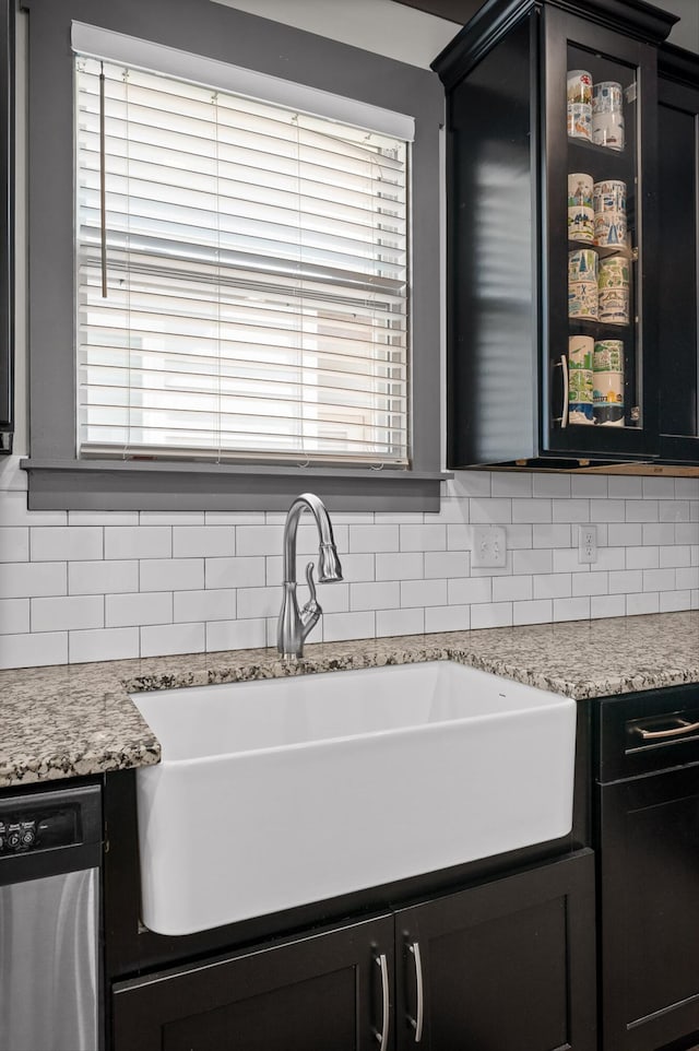 1422 Adams St, Chattanooga, TN 37408 - kitchen with a sink, dishwasher, tasteful backsplash, glass insert cabinets, and dark cabinetry