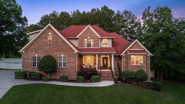 craftsman-style home with a lawn