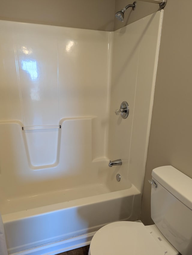 bathroom with shower / bathtub combination and toilet