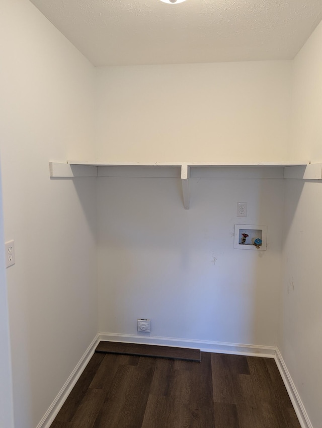 washroom with washer hookup, dark wood-type flooring, hookup for an electric dryer, and a textured ceiling