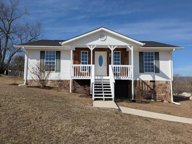 view of front of home with a front lawn and a porch