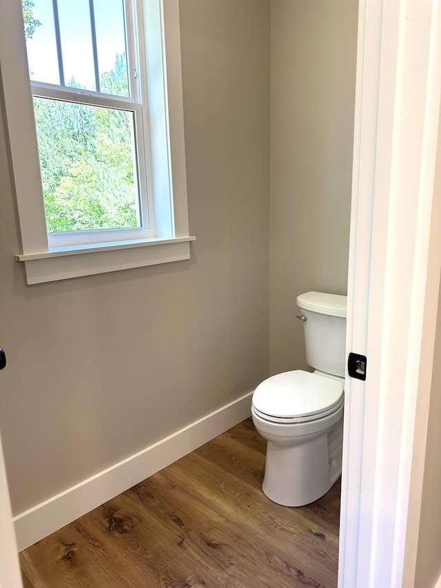 110 Dakota Dr NE, Cleveland, TN 37323 - bathroom featuring baseboards, wood finished floors, and toilet