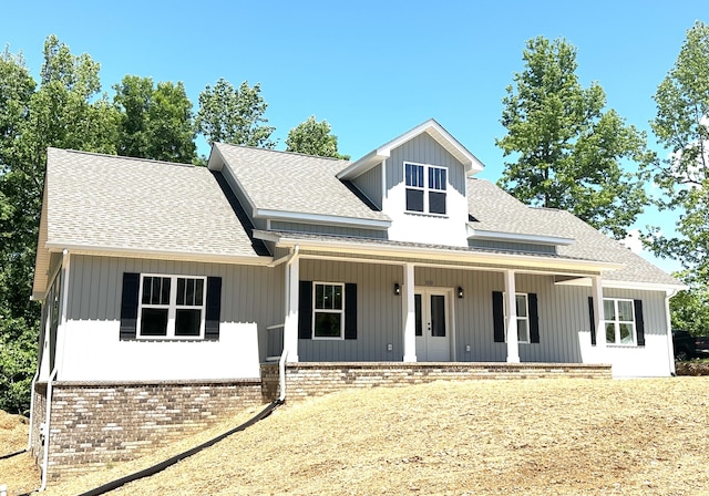 110 Dakota Dr NE, Cleveland, TN 37323 - view of front facade with a shingled roof, french doors, covered porch, and brick siding