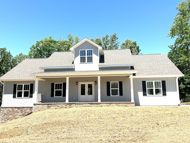 110 Dakota Dr NE, Cleveland, TN 37323 - view of front facade featuring roof with shingles, a porch, and french doors