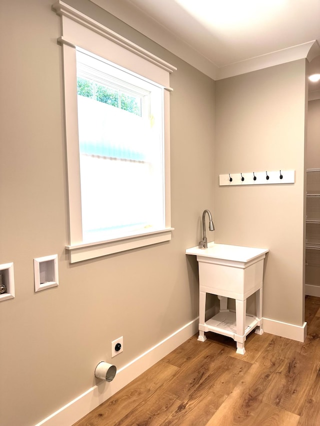 110 Dakota Dr NE, Cleveland, TN 37323 - laundry area featuring wood finished floors, baseboards, electric dryer hookup, hookup for a washing machine, and ornamental molding
