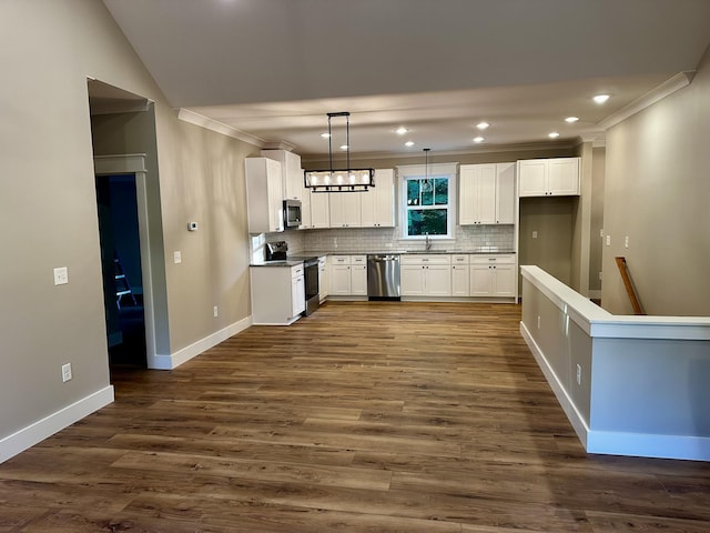 110 Dakota Dr NE, Cleveland, TN 37323 - kitchen featuring appliances with stainless steel finishes, ornamental molding, a sink, tasteful backsplash, and baseboards