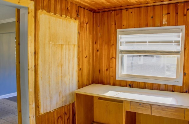 interior space with tile patterned floors, wood walls, and wood ceiling