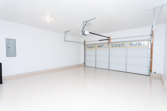 garage with a garage door opener and electric panel