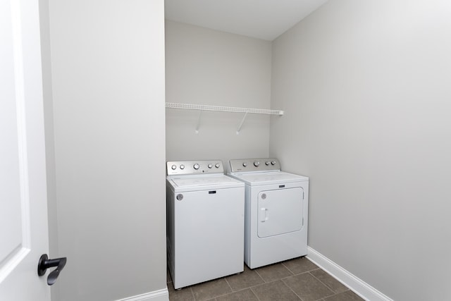 washroom with separate washer and dryer and tile patterned floors