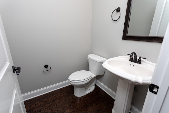 bathroom featuring toilet and hardwood / wood-style flooring