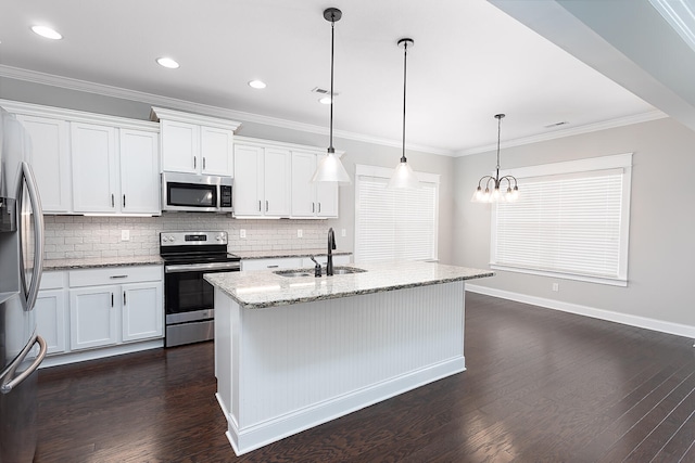 kitchen featuring pendant lighting, sink, white cabinetry, and stainless steel appliances