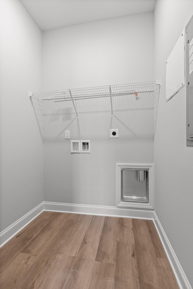 washroom featuring laundry area, hookup for an electric dryer, hookup for a washing machine, and wood finished floors