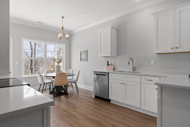 kitchen featuring ornamental molding, a sink, visible vents, and stainless steel dishwasher