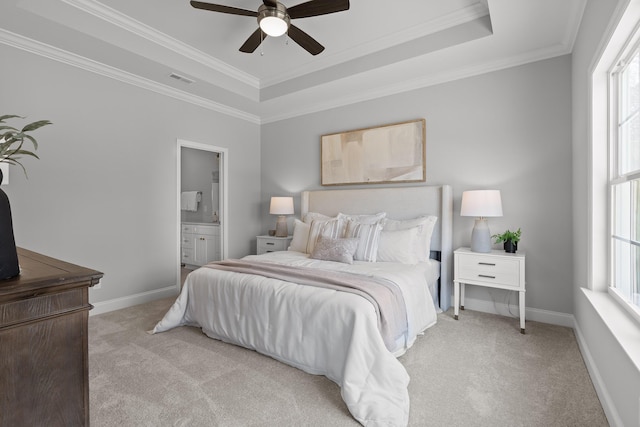 bedroom featuring multiple windows, light carpet, a raised ceiling, and ornamental molding
