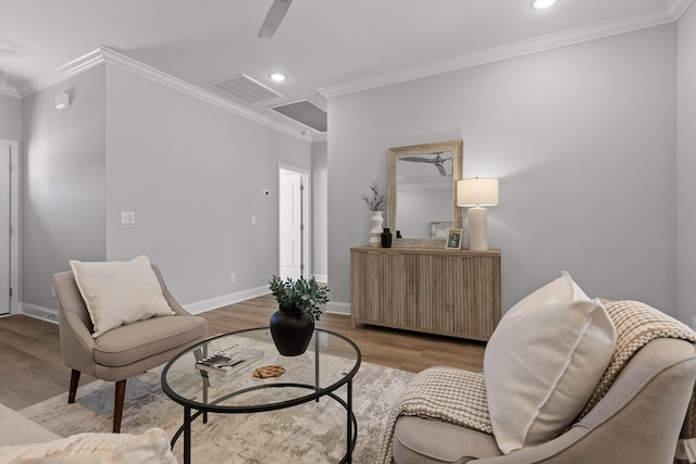 sitting room featuring a ceiling fan, recessed lighting, ornamental molding, visible vents, and light wood-type flooring
