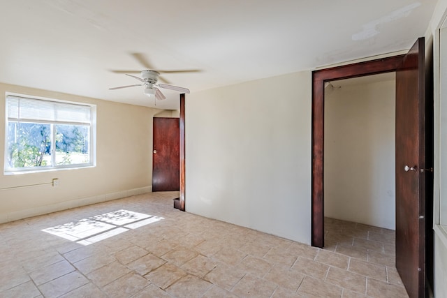 spare room featuring ceiling fan