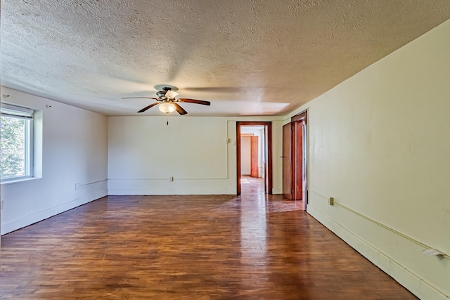 unfurnished room featuring a textured ceiling, dark hardwood / wood-style flooring, and ceiling fan